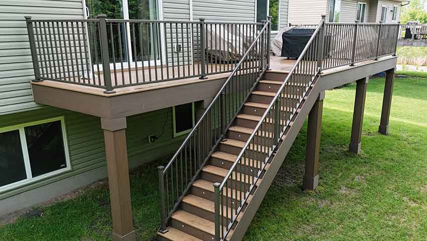 TREX Deck with Westbury Post Lights - Custom deck built by Dream Decks in Maple Grove, Minnesota